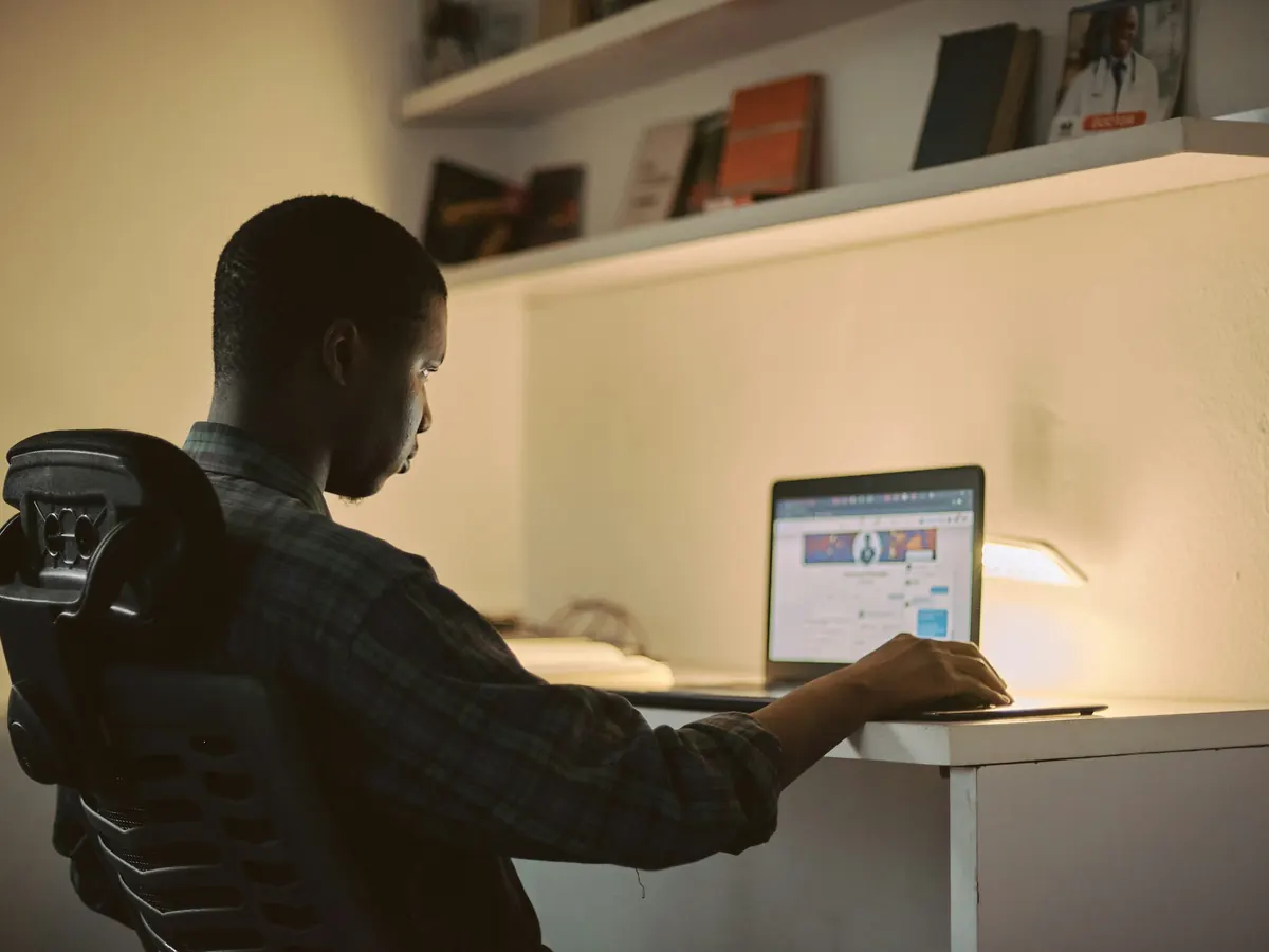 Developer reviewing work on a laptop at a desk